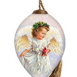 Hand-painted glass ornament featuring an angel with golden wings holding a red cardinal, adorned with a festive wreath crown.