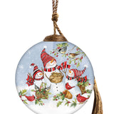 Hand-painted glass ornament featuring a joyful snowman family with red-striped hats, surrounded by cardinals and woodland animals in a snowy festive scene.