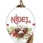 Hand-painted glass ornament with the word "Noel" surrounded by pinecones, holly, and festive berries.