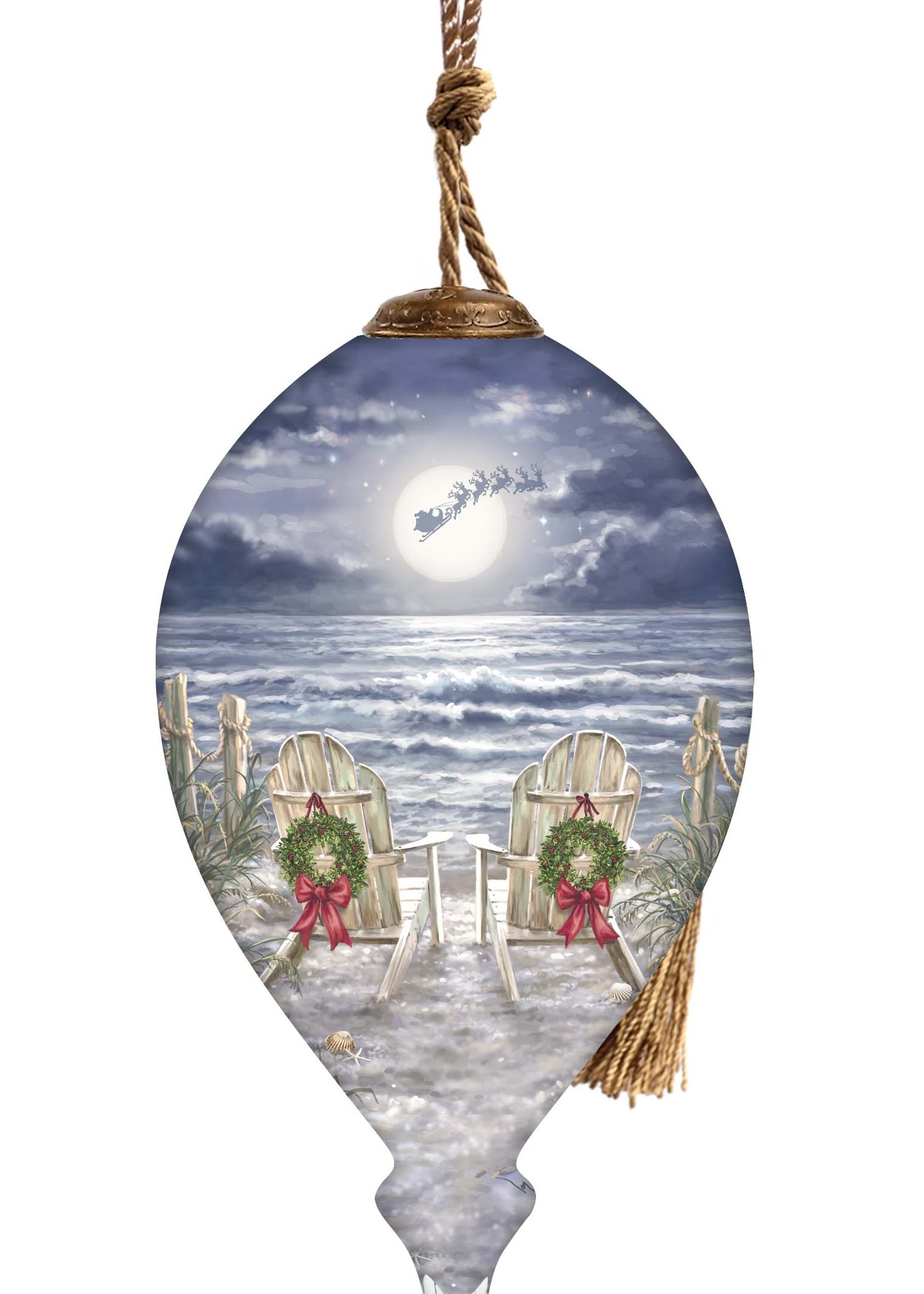 Hand-painted glass ornament featuring two chairs with wreaths on a moonlit beach, with Santa's sleigh flying across the night sky.