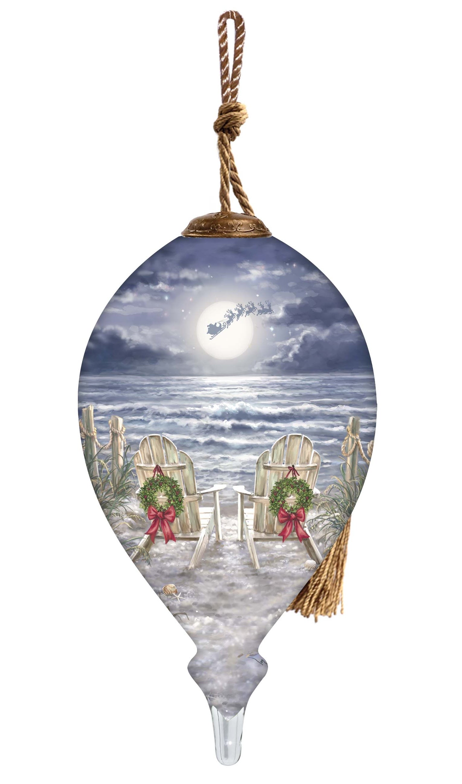 Hand-painted glass ornament featuring two chairs with wreaths on a moonlit beach, with Santa's sleigh flying across the night sky.